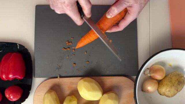 Professional Cook Meticulously Slicing Vibrant Produce For Wholesome Family Meal Preparation
