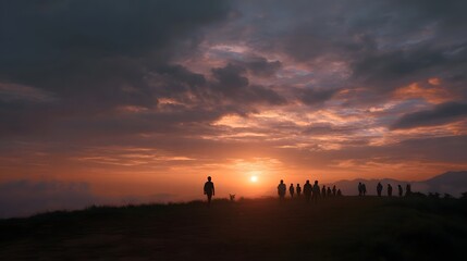 Fototapeta premium Silhouettes of people gather on a hilltop to witness a breathtaking colorful sunset sky