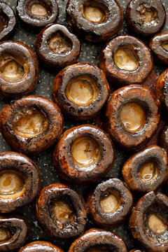 Brown mushrooms stuffed with mozzarella cheese and seasoned with thyme, top view