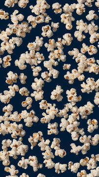 popcorn scattered on dark blue background minimal food backdrop with floating kernels snack texture for design and advertising