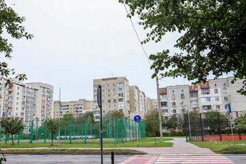 Urban residential district with sports court and apartments © Olha Tsiplyar