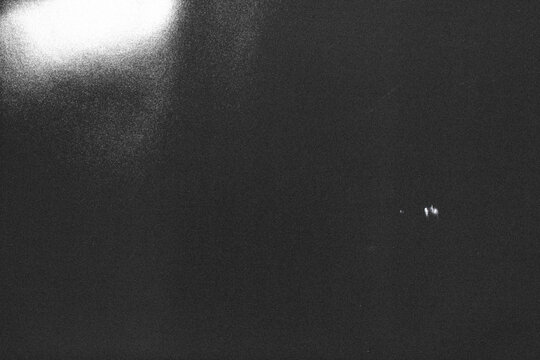 grunge flim texture overlay,retro film overlay effect with dust and light leaks,retro grain noisy film distressed texture light leak flare on black background,black paper background