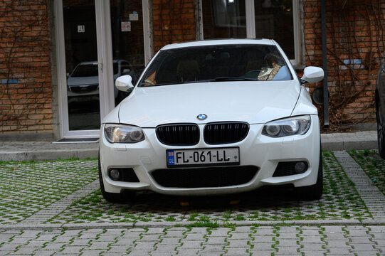  April 2, 2026, Tbilisi, Georgia BMW 3 Series white sedan parked in outdoor parking area