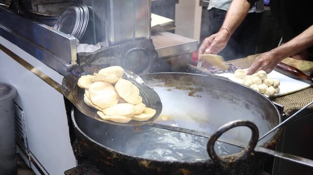 Poori deep frying in oil at old delhi 4k footage 