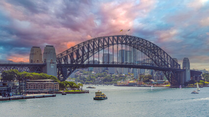 Fototapeta premium Panoramic view of Sydney Harbour and Circular Quay on a Beautiful Autumn Afternoon lovely colours of the sky in Sydney NSW Australia