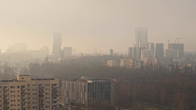 Aerial view of Katowice city skyscrapers panorama in hazy winter sun, Poland