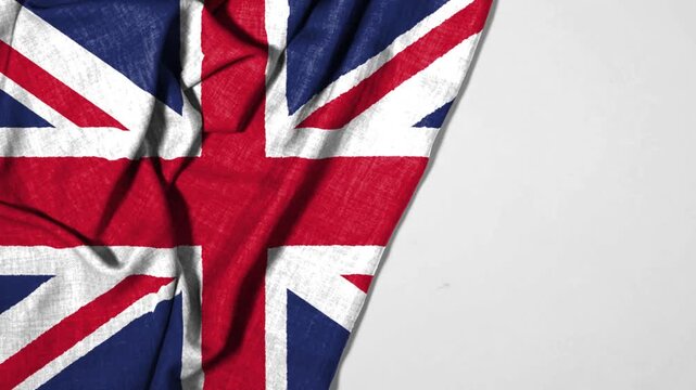 Union Flag or Union Jack the united kingdom flag representing a unified Great Britain of Wales, Scotland, Northern Ireland  England, combining the patron saint crosses waving in a gentle breeze