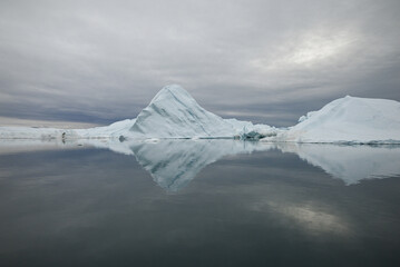 Ilulissat, Disko Bay, Greenland - Stunning Minimal Iceberg Landscape and reflections in Arctic Waters of Ilulissat Icefjord. © SJ Falcetta Images