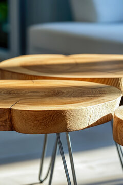 Three wooden stools resting on metal legs, possibly used as additional seating or decorative pieces. vertical frame