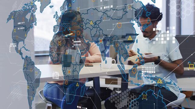 Colleagues sitting at break table eating and talking while world map fading in, tech HUD tracking