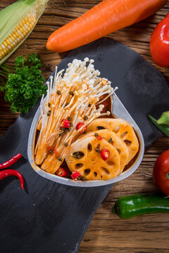 Pickled lotus root and enoki with chili