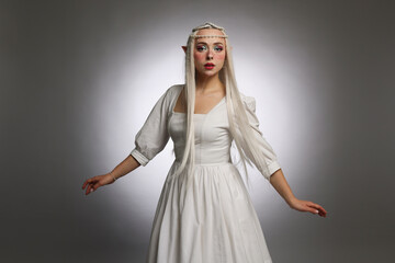 Naklejka premium Beautiful elf girl on grey gradient background