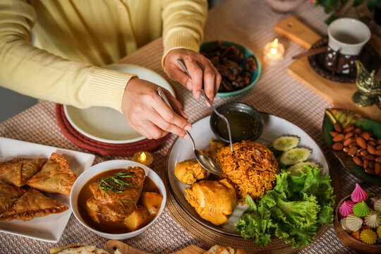 Ramadan iftar table with traditional dishes, dates, and festive family meal setting for Islamic food campaigns