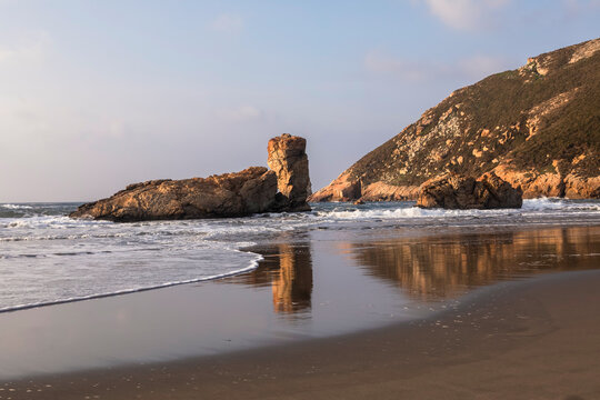 Coastal Landscape with Sea Stacks and Sandy Beach. Bayas beach. Asturias, Spain.
