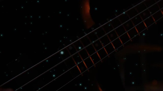 4-string bass neck tilting, teal specks drifting, hand entering and plucking strings, showing tone