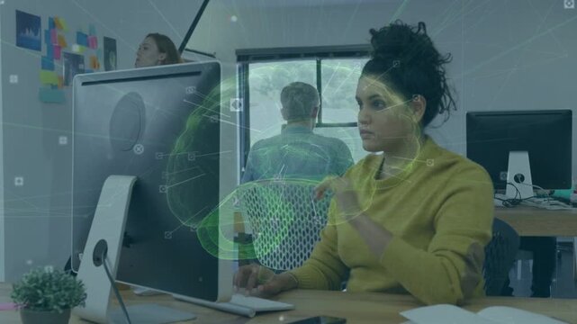 Woman at desk watching monitor, green brain overlay pulsing, causing typing tech analysis
