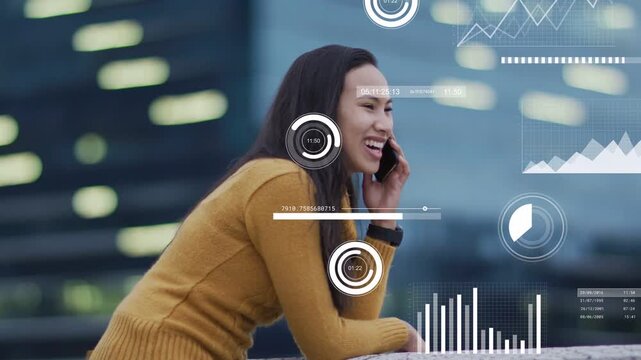 Woman leaning on railing, taking phone call while reviewing data with tech HUD charts overlaying