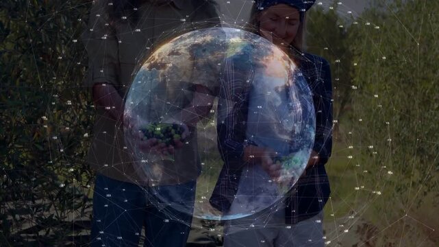 Rotating digital globe revealing faces and hands while farming pair presenting handfuls of olives