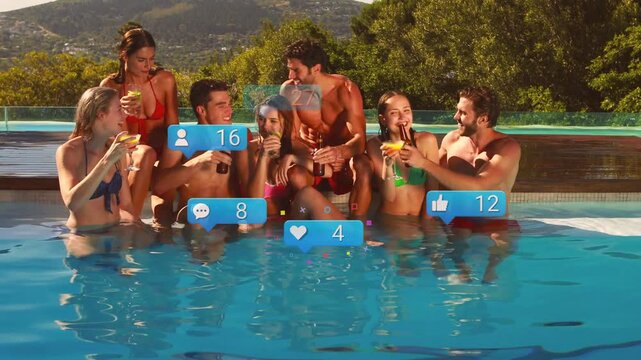 Seven friends celebrating on infinity pool ledge, tapping phone spawning social media bubbles