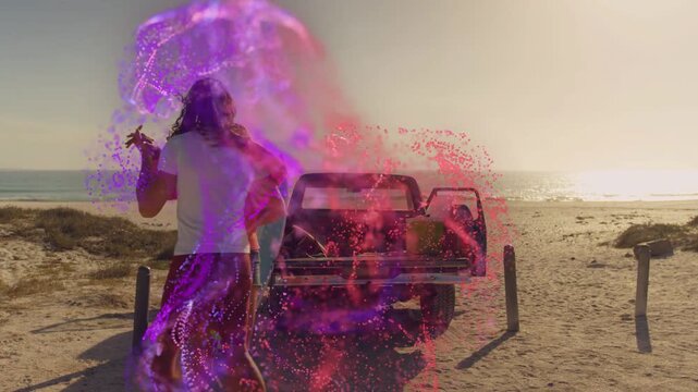 Couple dancing and spinning at shore near pickup, generating magenta ribbon swirling, marketing