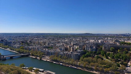 Fototapeta premium The city of Paris. From the top of the Eiffel Tower. The Seine River.
