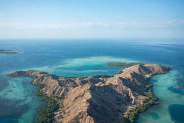 Aerial view of Pulau Siaba Besar island on a sunny tropical day © Hector