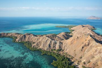 Aerial view of Pulau Siaba Besar island on a sunny tropical day © Hector
