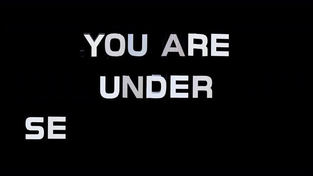 glitching text with words you are under surveillance