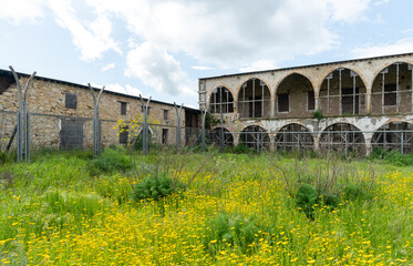 Fototapeta premium Saint panteleimon monastery, a historic religious building in cyprus, stands abandoned, showing decay with its bell tower. Northern Cyprus abandon orthodox christian church