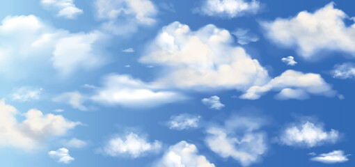 Fototapeta premium Light clouds in the blue sky. Blue Sky and puffy clouds. A horizontal shot of bright blue sky with puffy white clouds.
