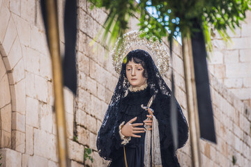 Statue of Madonna Addolorata (Our Lady of Sorrows) during the Procession of the Mysteries on Good Friday in the narrow streets of Bari old town, a deeply solemn, old tradition © Michele Ursi