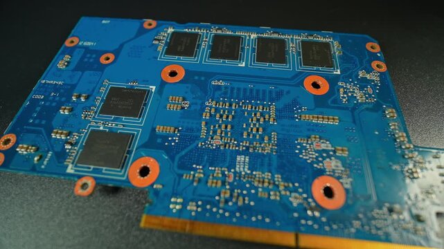 GPU video card back side card designed with black chips semiconductors integrated circuits ICs, with GDDR VRAM various power management and interface controllers