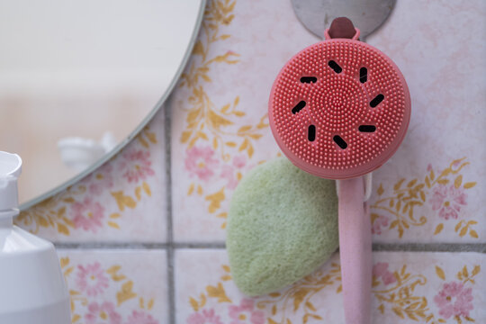 Silicone Massage Brush in Old Bathroom Interior Close Up Skincare and Hygiene