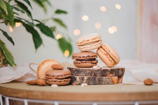 Almond flour fresh macaroons on a wooden plate