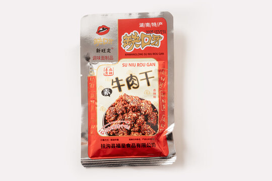 Moscow Russia 22.08.2025 Packaged beef jerky snack with Chinese labeling isolated on white background. Spicy meat snack, protein food, retail packaging and Asian convenience product.