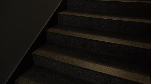 Ascending Dark Granite Staircase 4K Low Angle Upward Motion Empty Steps in Dim Interior Architecture Loopable Progress Path