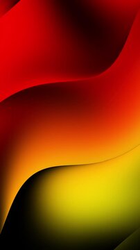 Vibrant abstract background animation with smooth gradient waves in red, orange, and yellow hues, transitioning to black, creating a dynamic visual effect.