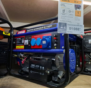 VORONEZH, Russia - April 8, 2026.Blue and black Spets SB gasoline generator displayed on a shelf in a warehouse at a retail outlet in Russia with a price tag shown