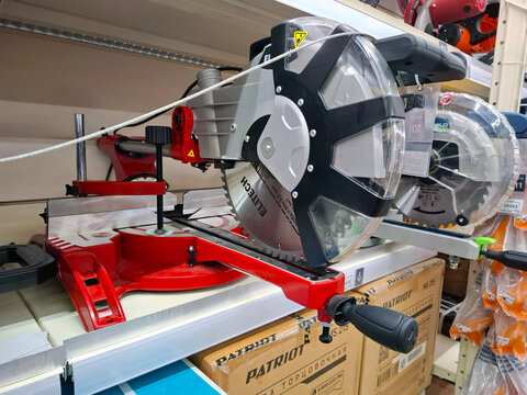 VORONEZH, Russia - April 8, 2026.An Elitech miter saw is shown on a shelf in the construction equipment area of a supermarket in Russia. The saw has a clear protective blade guard and is ready for dis