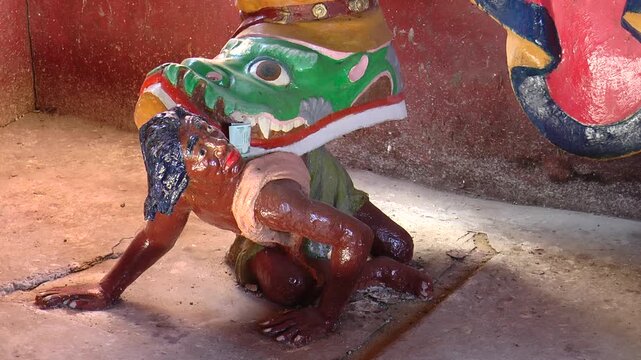  Detail of a sculpture of the guardian god in the Maharaj Chapel. A red-skinned sinner under the heel of a formidable deity. Amarbayasgalant Monastery, Mongolia.