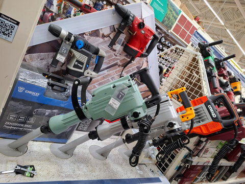 VORONEZH, Russia - April 8, 2026.Large industrial demolition hammers and rotary drills displayed in a hardware store in Russia for customers to view and purchase