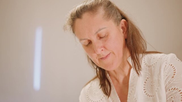 Closeup of woman testing pumpkin pie filling in modern kitchen, precise measuring and steady hands, studiostyle light, neutral interior, tutorial vibe showing technique and concentrated expression