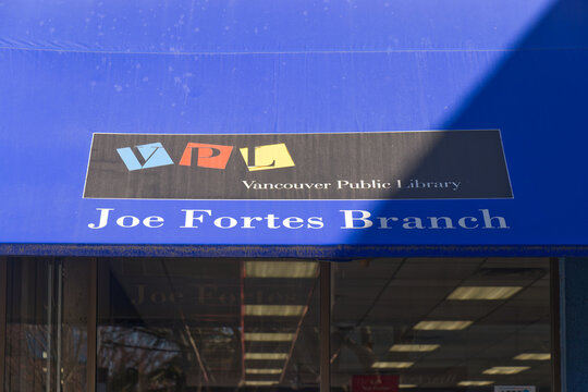 Vancouver Public Library Joe Fortes Branch blue awning sign with VPL logo in West End neighbourhood.