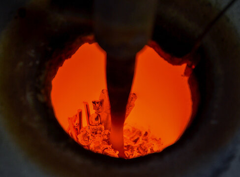 Gold or silver melting process in a crucible of a jewelry furnace, high temperature