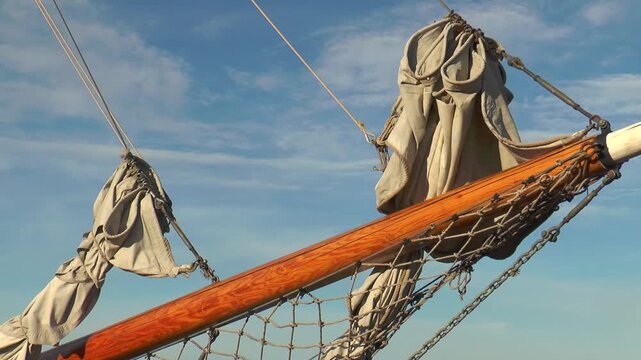 Helsinki, Finland. Sailing schooner at the pier, schooner bowsprit.
  Warm summer evening.