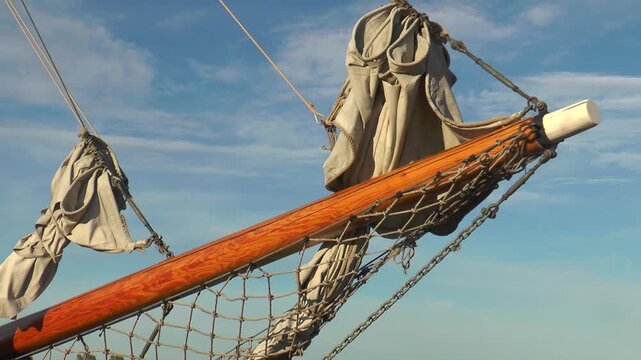 Helsinki, Finland. Sailing schooner at the pier, schooner bowsprit.
  Warm summer evening.