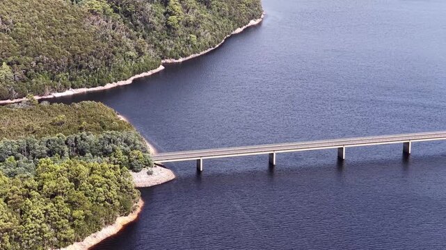Close aerial view of Bradshaw bridge across Burbury lake in Tasmania &ndash; scenic landscape.