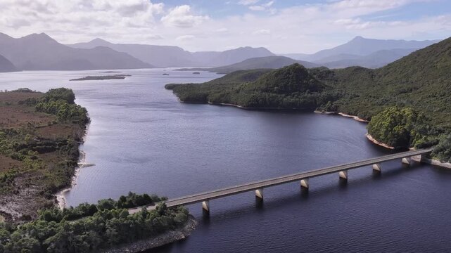 Bradshaw bridge narrow part of Burbury lake in Tasmanian West Coast mountains.