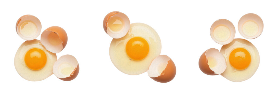 Collection of Raw Cracked Chicken Eggs with Vibrant Yellow Yolks and Brown Eggshells Isolated on White Background for Baking, Breakfast Cooking, Organic Nutrition, and Food Design