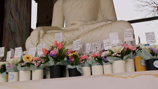 Jogyesa Temple Seoul Korea Buddha statue flowers tilt up spiritual scene